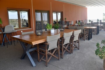 Outdoor balcony restaurant at a grape and olive orchard in Crete, Greece