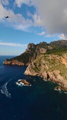 Obraz premium Coastal cliffs meet the deep blue sea