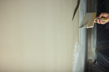 Applying a Fresh Layer of Paint to a Wall Using a Trowel for a Stunning and Beautiful Finish