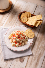 Macaroni salad with elbow pasta and canned tuna, served with saltine crackers. Easy and healthy recipe.