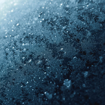 Frost patterns on a frozen car window surface