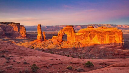 Golden Hour Panoramic of Arches National Park with Dramatic Sandstone Formations and Desert Landscape

