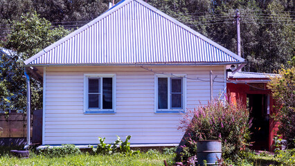 white small house in the garden