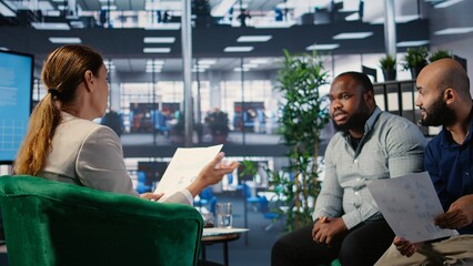 Office meeting highlighting leadership and business planning for a new partnership between powerful people using metrics and strategy to drive performance and development. Camera A.