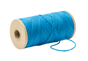 Bright blue sewing thread on spool isolated on black background for crafting and textile projects