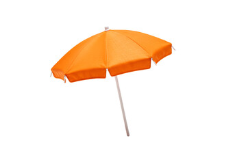 Obraz premium bright orange beach umbrella with a white pole isolated against solid black background perfect for