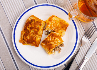 Delectable pancakes, featuring filling of minced liver and eggs, perfect for your next breakfast