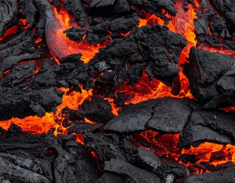 Lava and black volcanic rock close-up texture