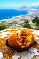Arancini Sicilian, deep-fried rice balls made with risotto, filled with ingredients mozzarella,...