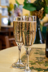 Pouring and tasting of dry sparkling wine brut, grand reserve, champagne in Ay-Champagne wine making village in Vallee de la Marne, , Champagne region, France