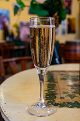 Pouring and tasting of dry sparkling wine brut, grand reserve, champagne in Ay-Champagne wine making village in Vallee de la Marne, , Champagne region, France