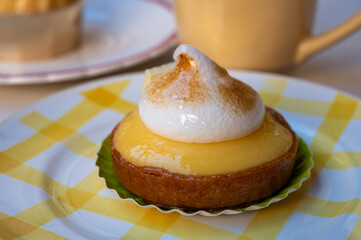 One piece of lemon tart with white eggs meringue from French pastry shop