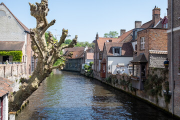 Naklejka premium Views of canals, briges and old facades of medieval buildings in Bruges, Flanders, Belgium, travel destination