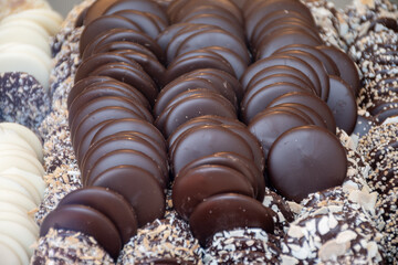Famous Belgian chocolate candies on display in confectionery shop in Bruges, Belgium