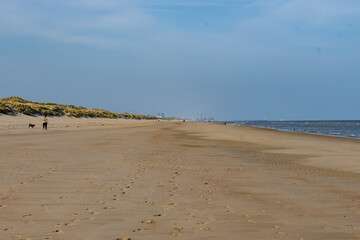White sandy beach in cosy seaside holiday village on North Sea, built in belle epoque style in Flanders, De Haan or Le Coq sur Mer, Belgium