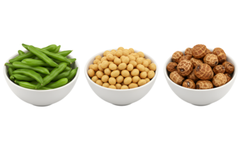 Assorted bowls of fresh green snap peas chickpeas and roasted hazelnuts in a row on a black