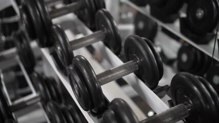 Travel Shot of Dumbbell Rack in Exercises Gym Exercising Equipment to Stay in Shape
