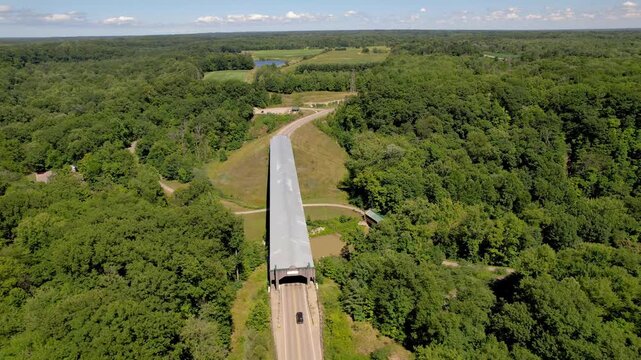 Aerial view of longest covered bridge in North America, Known as Smolen-Gulf Bridge over Ashtabula river in Ohio, USA.