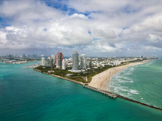 Top view of South Miami Beach. Scenic drone view of Miamis famous coastline. Miami Beach skyline with skyscrapers. Aerial view of Miami Beach in summer. Miami Beach shore with skyscrapers.