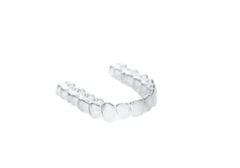 Clear Invisalign dental aligner on black background highlighting orthodontic treatment