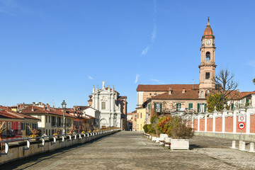 Corso Cottolengo, place where is located the birthplace of St Giuseppe Benedetto Cottolengo, with the churches of Santissima Trinit&agrave; (right) and Sant'Andrea, Bra (Cuneo), Piedmont, Italy