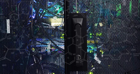 Fototapeta premium Highlighting black vertical latch locking perforated cabinet door in data center, with green LEDs