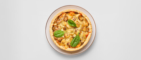 Mushroom pie with spinach leaves on white background