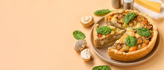Mushroom pie with spinach leaves and champignons on beige background