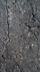 Dark asphalt with deep crack