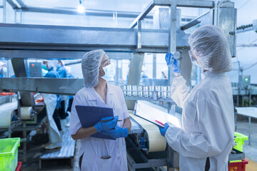 Food and manufacturing researchers oversee seafood production lines in tightly controlled factories where machinery is used to produce and cook food before it is shipped out.