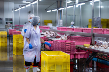 Food and manufacturing researchers oversee seafood production lines in tightly controlled factories where machinery is used to produce and cook food before it is shipped out.