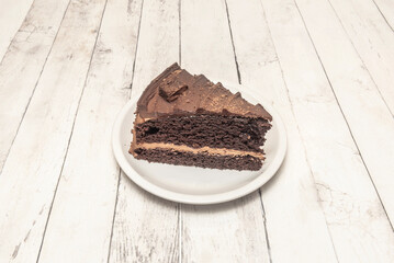 Chocolate and candied orange cake with a touch of Grand Marnier and citrus. Decorated