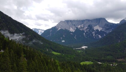 Fototapeta premium Mountain valley vista under a cloudy sky