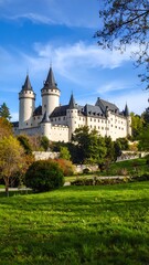Fototapeta premium Grand castle with manicured gardens