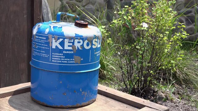 Kerosene can sitting on wooden box 4k