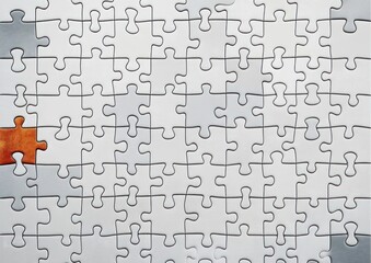 Incomplete white jigsaw puzzle with one brown missing piece creating contrast and visual tension