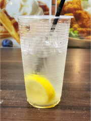 Lemonade or lemon juice close up background. Stock photo.