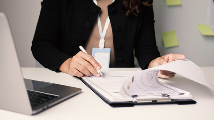 Businesswoman employer holding resume, recruiting, planning, evaluating and reviewing resume of job applicant, recruiting new employees, recruitment concept