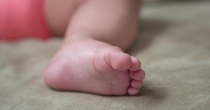 Child foot tickled by finger 4k