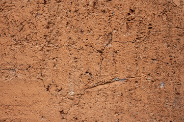 Full frame shot of an earthen wall texture of clay house structure.