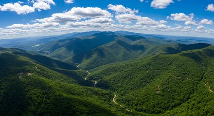 Fototapeta premium Panoramic View of Green Mountain Ranges on a Sunny Day