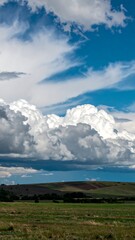 Dramatic sky over a grassy field