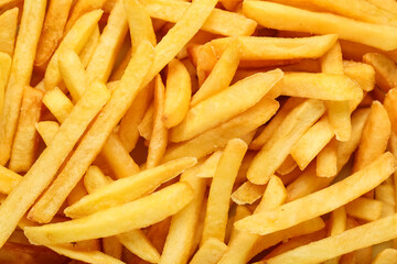Texture of tasty french fries as background