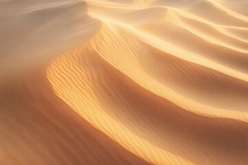 Soft glowing sunlight illuminating smooth sand dunes with gentle rippled patterns in a peaceful desert landscape