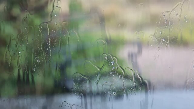 Sad rainy day with water drops on door, melancholy 