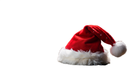 Photo of red santa hat with white fluffy trim and pompom isolated on transparent background