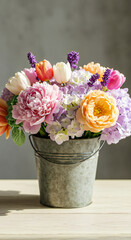 Fototapeta premium Elegant Bucket of Pastel Spring Flowers in Soft Light – Romantic Floral Arrangement