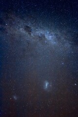 Fototapeta premium Gazing at the starry sky in new zealand, reflecting on childhood memories under countless stars