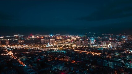 Enchanting nighttime skyline of Xichang, China with vibrant urban glow and captivating cityscape charm