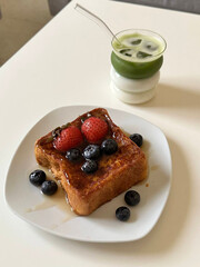 French toast with berries and matcha.